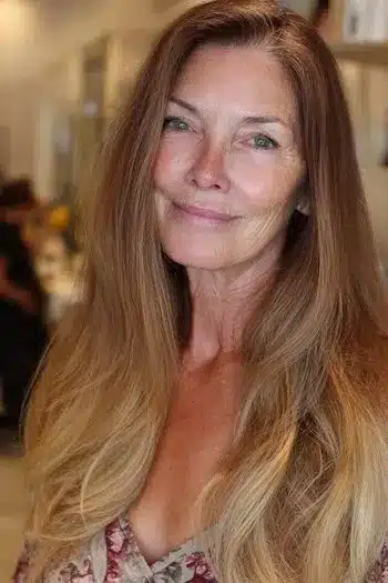 Ombre color blended with layers, featured in 30 inspiring long hairstyles for women over 50 with fine hair.