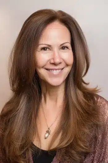 High-volume feathered layers for fine hair, featured in 30 inspiring long hairstyles for women over 50 with fine hair.