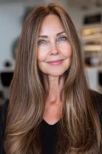 Subtle highlights woven through long fine hair, part of 30 inspiring long hairstyles for women over 50 with fine hair.