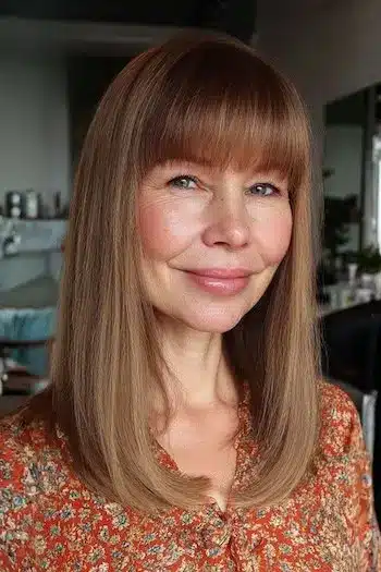 31 Hairstyles With Bangs That Prove A Little Fringe Goes A Long Way 12 Pin-straight hair with full blunt bangs, from the 31 Hairstyles With Bangs That Prove A Little Fringe Goes A Long Way - Parisfy