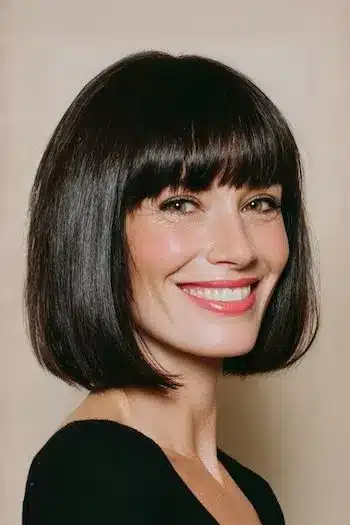 31 Hairstyles With Bangs That Prove A Little Fringe Goes A Long Way 5 A medium bob cut with a blunt fringe, showcasing the 31 Hairstyles With Bangs That Prove A Little Fringe Goes A Long Way - Parisfy