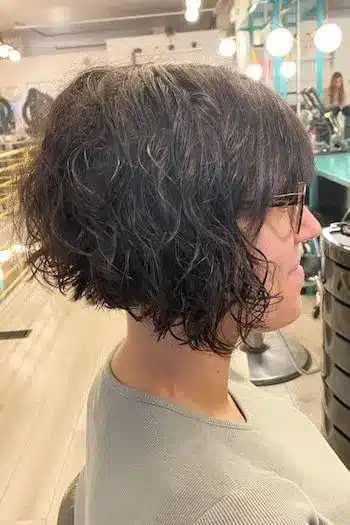 Short Curly Angled Bob with Bangs Haircut