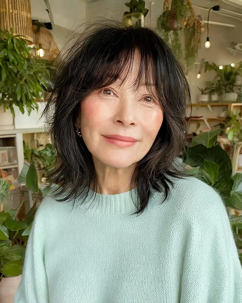 Korean-inspired shag haircut with wispy layers and soft fringe for playful women over 50, part of 20+ youthful shaggy hairstyles women over 50 are wearing in 2026