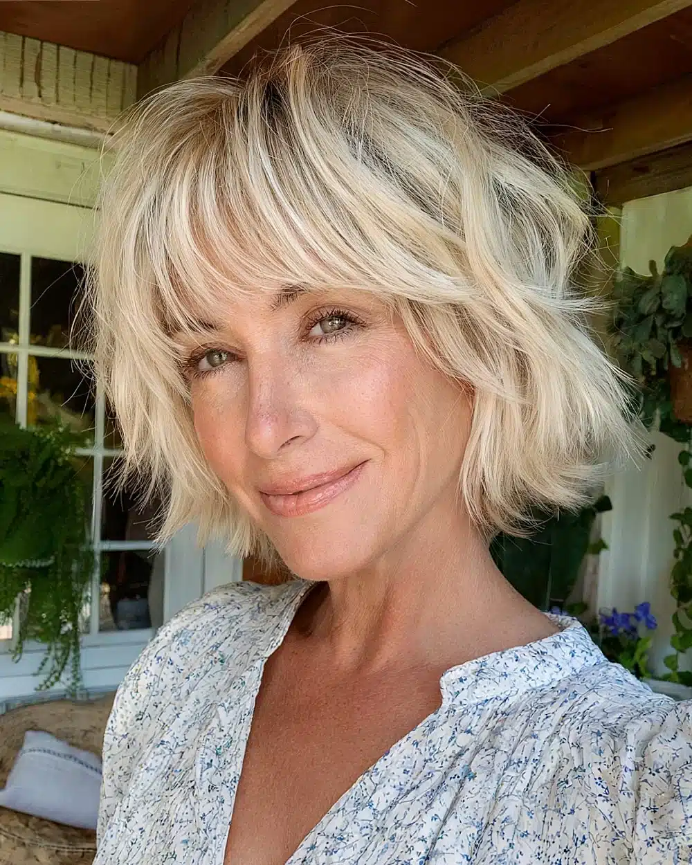 Short shaggy bob with bangs and textured layers for voluminous hair in women over 50, part of 20+ youthful shaggy hairstyles women over 50 are wearing in 2026