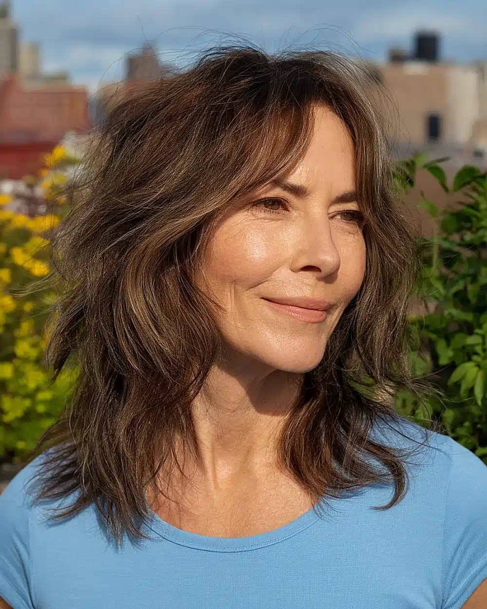 Long shaggy haircut without bangs and subtle face-framing layers for women over 50, showcasing 20+ youthful shaggy hairstyles women over 50 are wearing in 2026