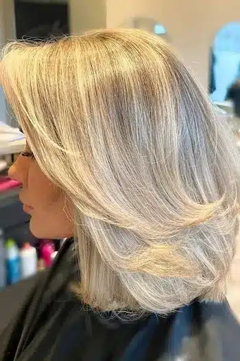30 Trending Old Money Bob Haircuts With A Quiet Luxury Aesthetic 16 Feathered layers in a blonde bob, showcasing the 30 Trending Old Money Bob Haircuts With A Quiet Luxury Aesthetic - Parisfy.