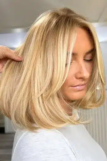 30 Trending Old Money Bob Haircuts With A Quiet Luxury Aesthetic 18 Long side bangs with soft texture, featured in the 30 Trending Old Money Bob Haircuts With A Quiet Luxury Aesthetic - Parisfy.