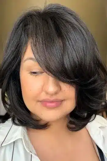 30 Trending Old Money Bob Haircuts With A Quiet Luxury Aesthetic 25 Voluminous bob with tucked ends, showcasing the 30 Trending Old Money Bob Haircuts With A Quiet Luxury Aesthetic - Parisfy.
