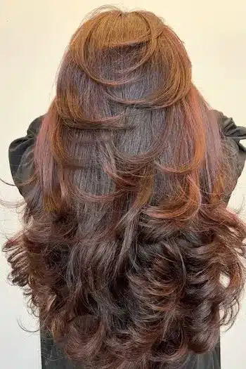 31 Butterfly Haircut Ideas For The Perfect Layered Hairstyle 12 Long layered butterfly haircut with soft curls and bouncy movement