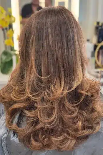 31 Butterfly Haircut Ideas For The Perfect Layered Hairstyle 15 Fluffy butterfly haircut with light waves and textured layers