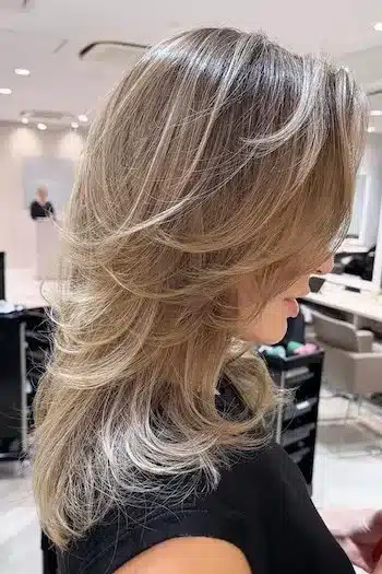 31 Butterfly Haircut Ideas For The Perfect Layered Hairstyle 16 Butterfly cut with golden tones for thin hair and added volume