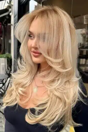 31 Butterfly Haircut Ideas For The Perfect Layered Hairstyle 3 Blonde butterfly layered hairstyle with wispy layers and silky waves