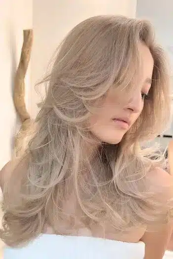 31 Butterfly Haircut Ideas For The Perfect Layered Hairstyle 21 Platinum butterfly layers with face-framing highlights and cool tones