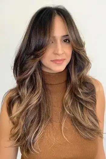 31 Butterfly Haircut Ideas For The Perfect Layered Hairstyle 27 Sun-kissed butterfly layered hair with warm tones and bright dimension
