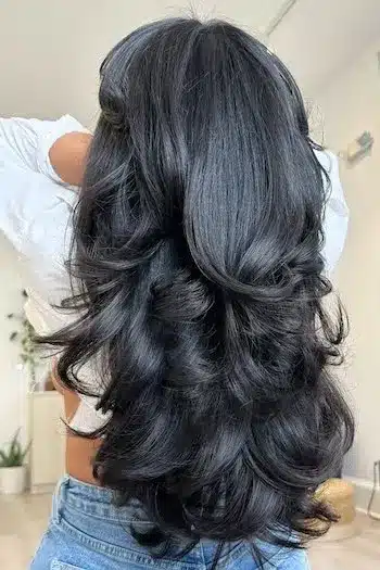 31 Butterfly Haircut Ideas For The Perfect Layered Hairstyle 6 Black glossy butterfly haircut with sleek layers and polished finish