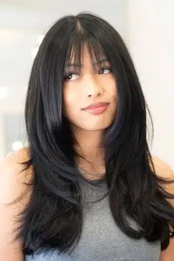 31 Butterfly Haircut Ideas For The Perfect Layered Hairstyle 8 Sleek butterfly hairstyle with wispy bangs and face-framing layers