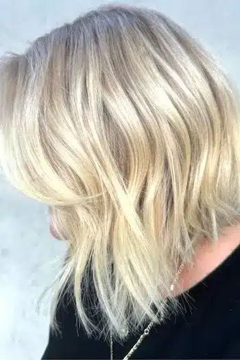 32 Fresh Summer Haircuts You’ll Want To Try This Season 14 Textured angled lob with a longer front and sleek back