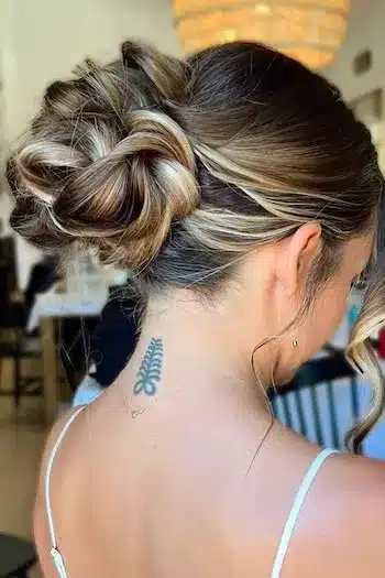 32 Fresh Summer Haircuts You’ll Want To Try This Season 22 Twist bun with loose face-framing tendrils and caramel highlights