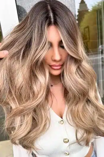 32 Fresh Summer Haircuts You’ll Want To Try This Season 29 Beach bronde wavy hair with warm brown and blonde tones