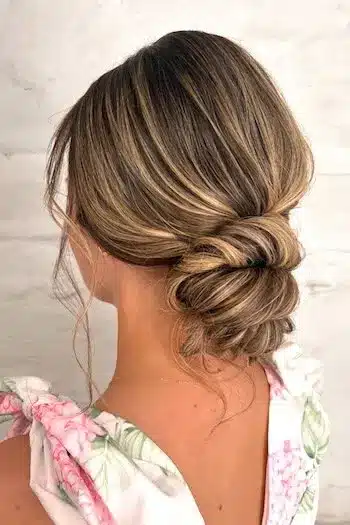 32 Fresh Summer Haircuts You’ll Want To Try This Season 4 Low twisted bun with subtle highlights catching the sunlight