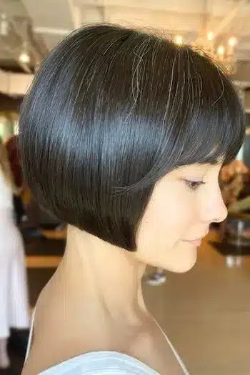 Angled French bob on a woman with brown hair, side view