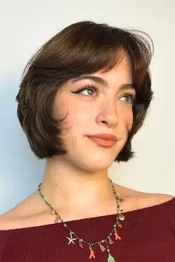 Curved French bob on a woman with brown hair