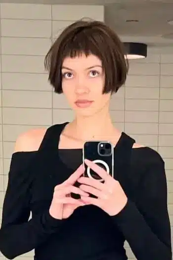 Selfie of an ultra short French bob on a woman with brown hair