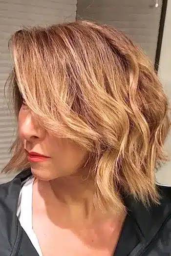 Choppy layered wavy bob with uneven, textured cuts