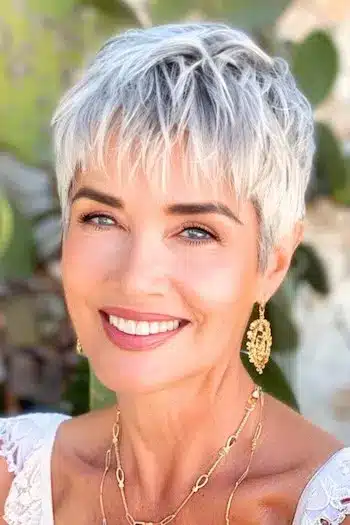 Textured piecey pixie on a smiling woman with gray silver hair