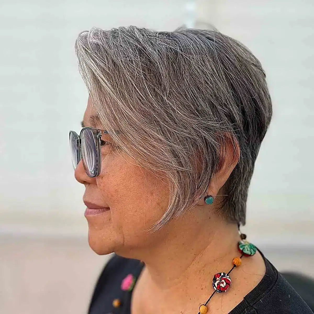 51 Cutest Wash and Wear Haircuts for Women Over 50 12 Easy-maintenance natural grey pixie with long bangs for women over 50