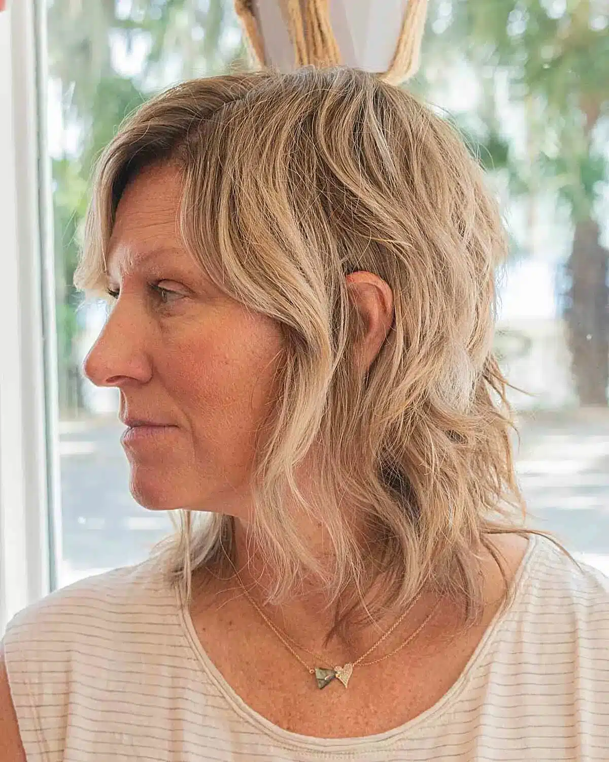 51 Cutest Wash and Wear Haircuts for Women Over 50 19 Wash and Wear Medium Wavy Hair with Choppy Layers for 50-Year-Old Ladies with Long Face Shapes