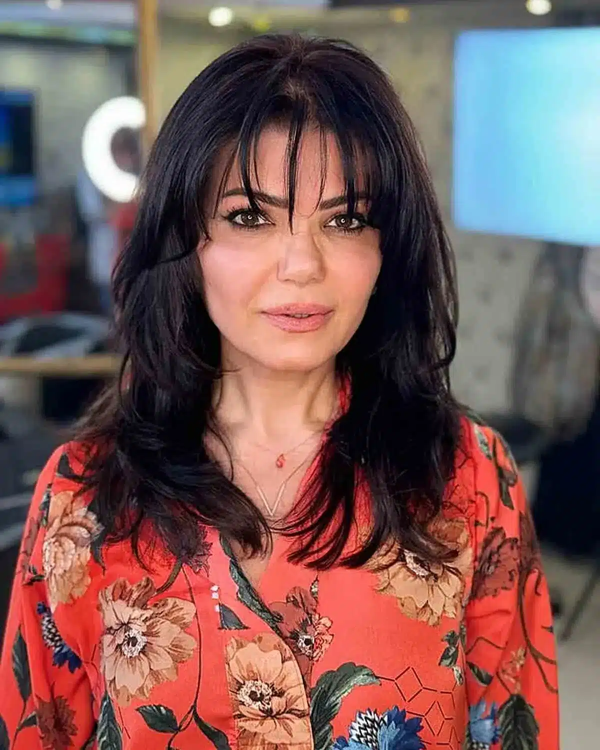 51 Cutest Wash and Wear Haircuts for Women Over 50 31 Wash-and-Wear Chest-Length Tousled Hair with Waterfall Fringe for Ladies Over 50