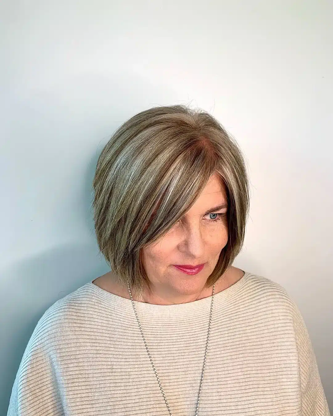 51 Cutest Wash and Wear Haircuts for Women Over 50 47 Thick Silver Bob with Fringe for Ladies Over 50