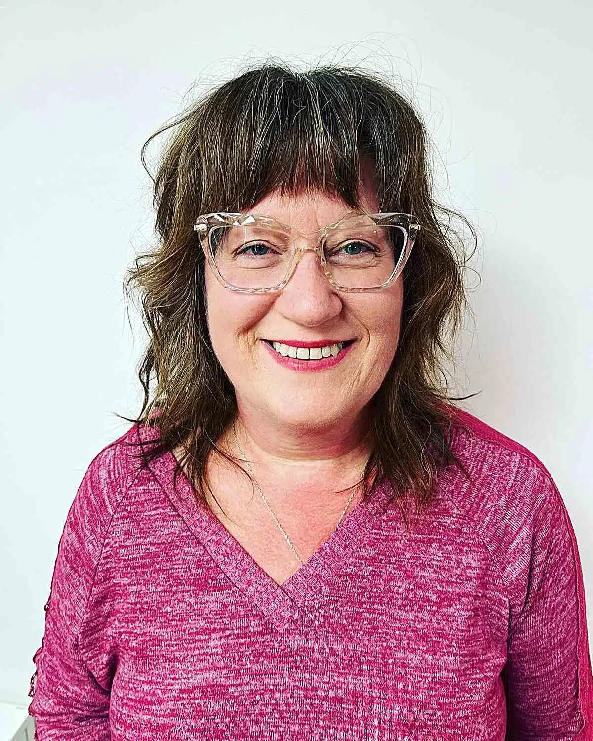 51 Modern Medium Shaggy Hairstyles Women Over 60 Can Pull Off 31 Wavy mid-length shag with heavy bangs for women over 60, featured in 51 Modern Medium Shaggy Hairstyles Women Over 60 Can Pull Off