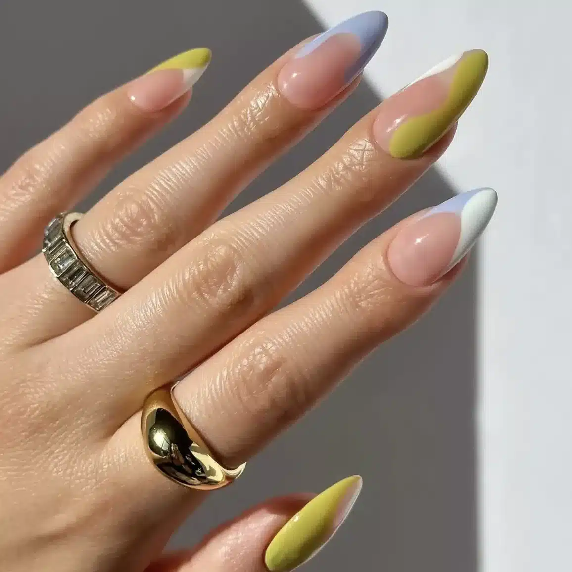 18 Olive Green Nail Ideas for an Unexpected Spring Manicure 6 Olive green and pale blue swirl nail design